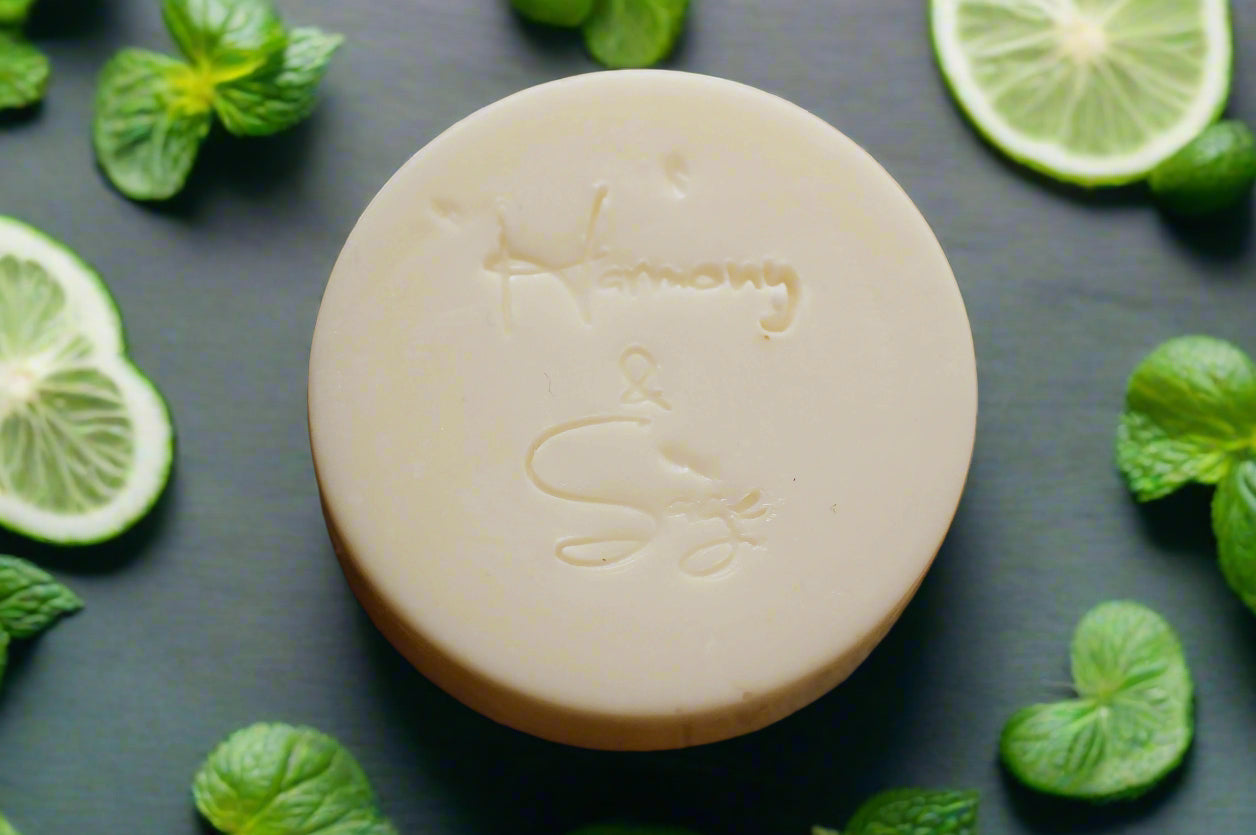 Bar of soap with a brand logo on a wooden surface