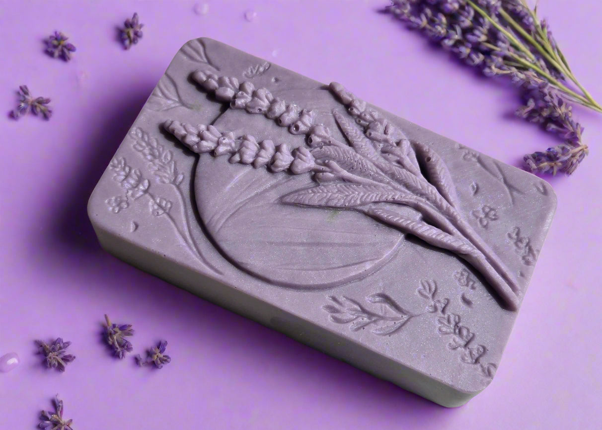 Purple soap bar with floral design on a wooden surface