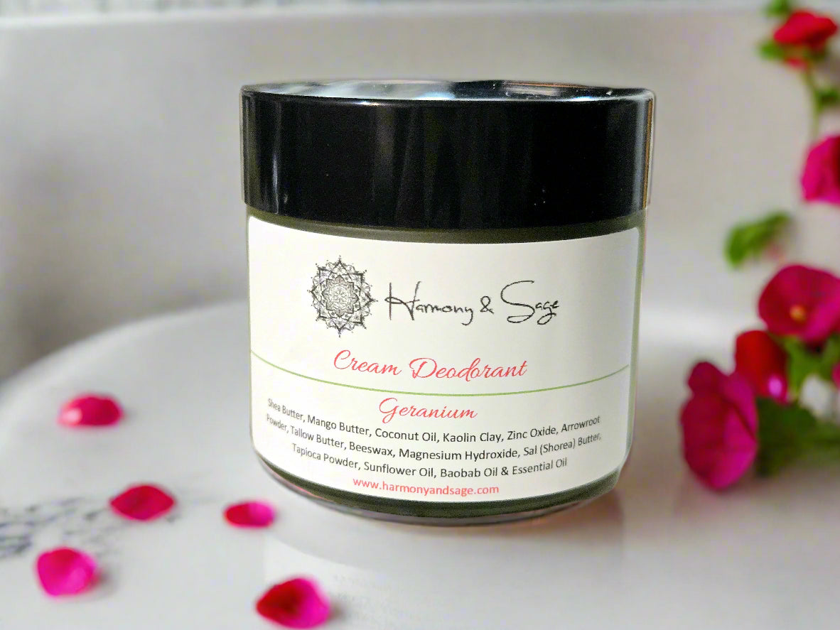 Cream deodorant jar labeled 'Harmony & Sage' on a wooden surface.