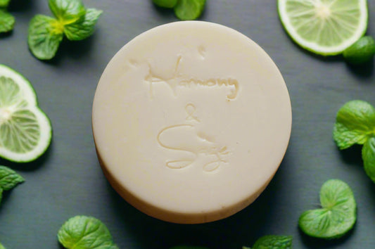 Bar of soap with a brand logo on a wooden surface