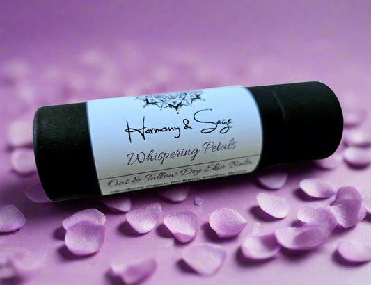 Black and white skin balm stick with 'Harmony & Sage' branding on a light wooden surface.