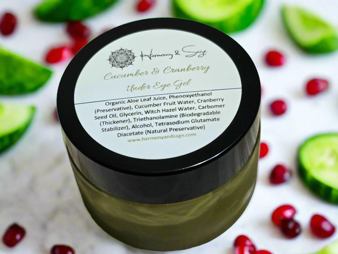 Jar of Cucumber & Cranberry eye gel with a label on a wooden surface