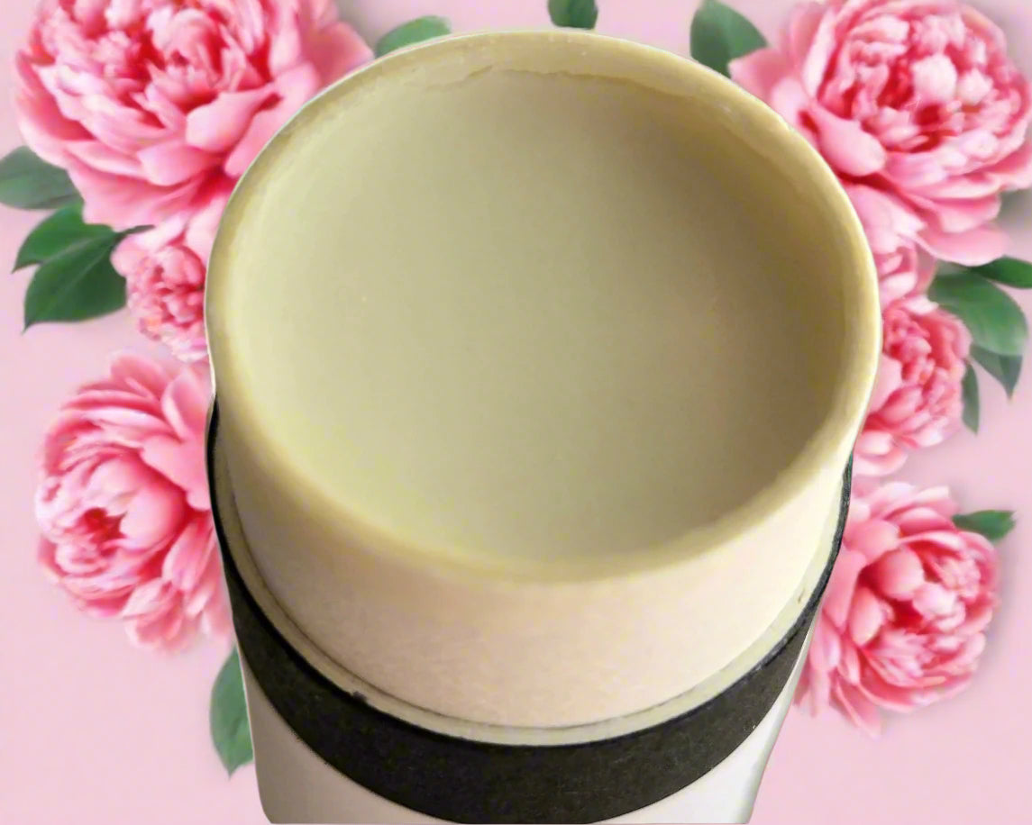Tube with a beige lid on a wooden surface
